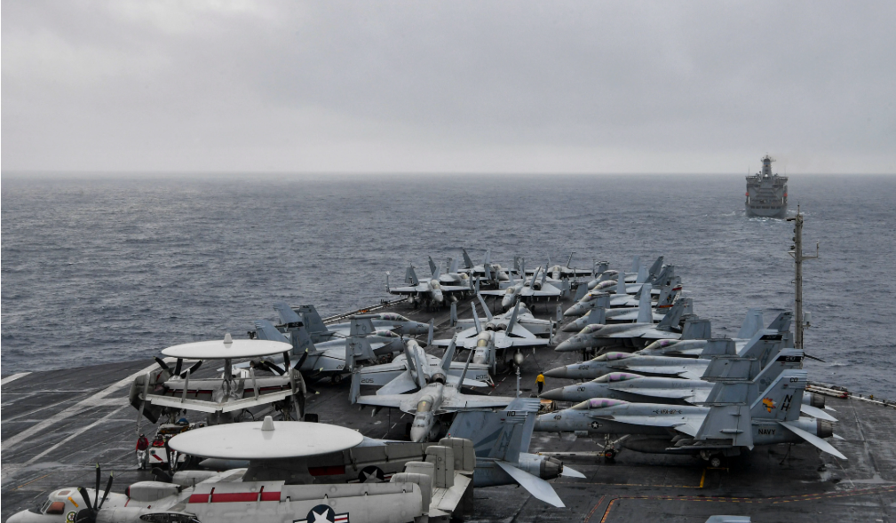 The aircraft carrier USS Theodore Roosevelt (CVN 71) approaches the fleet replenishment oiler USNS John Ericsson (T-AO 194) during a replenishment-at-sea Jan. 22, 2021. US Navy Photo, img from: https://news.usni.org/2021/01/25/chinese-foreign-ministry-u-s-south-china-sea-movements-do-no-good-for-region
